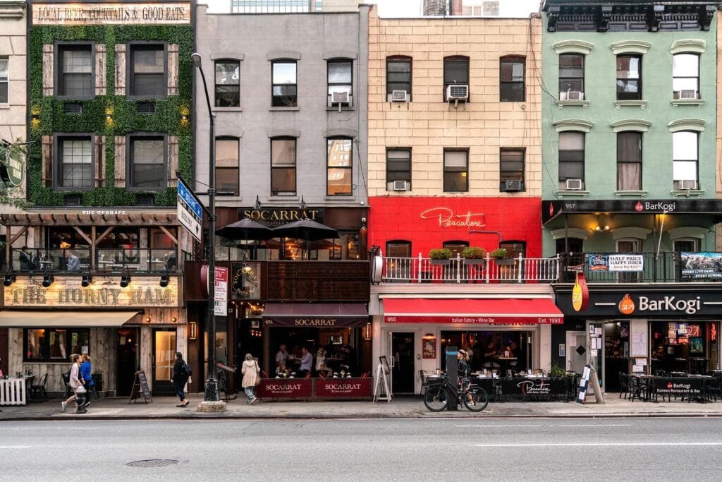 Restaurant storefront standing out among neighboring restaurants with distinctive branding and storefront design.